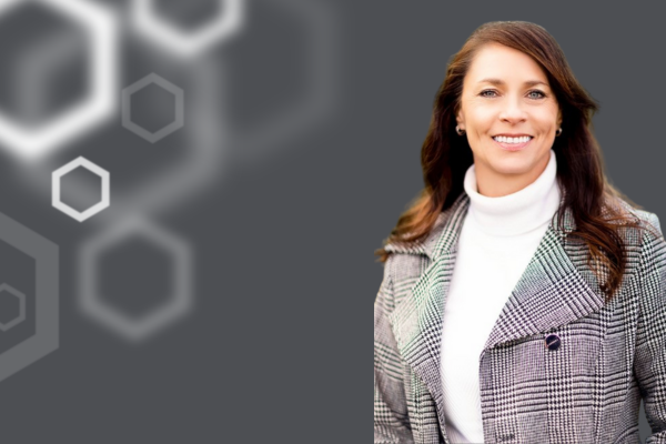 Arica Kulm with hexagons to her left.